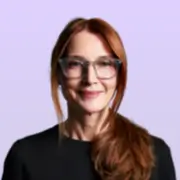 Red-haired woman wearing glasses, smiling portrait